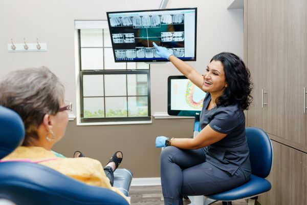 dentist showing dental x-rays