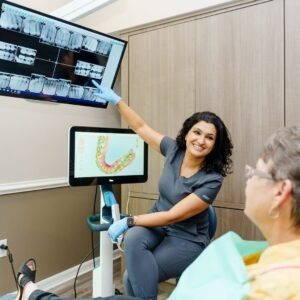 dentist showing a patient x-rays