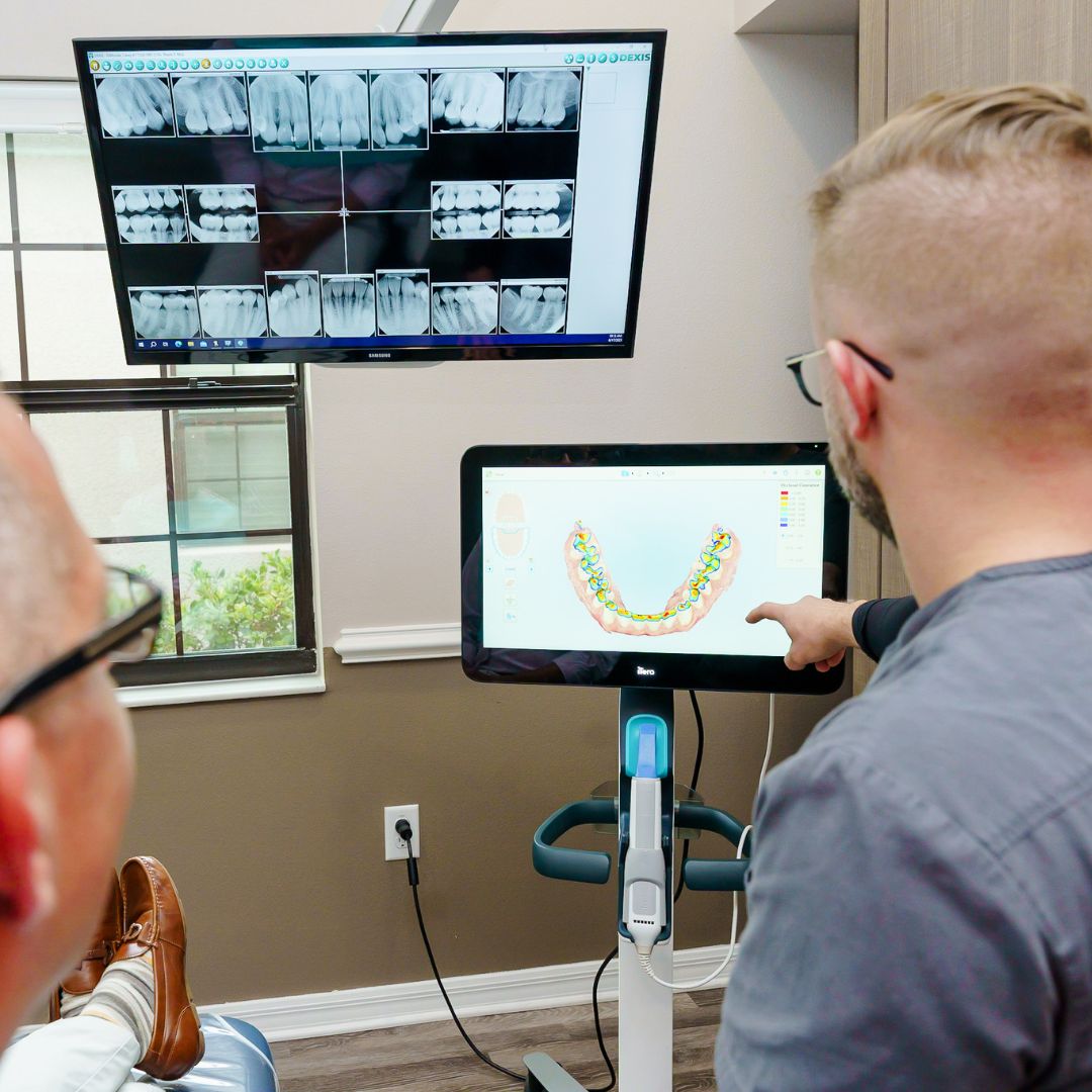 Dental professional providing a personalized consultation to client.