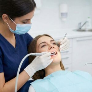 A dental hygienist performs a professional teeth cleaning
